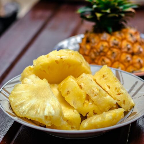 sliced pineapple on white ceramic plate