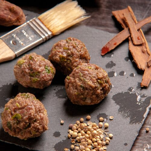 brown fried food on black surface