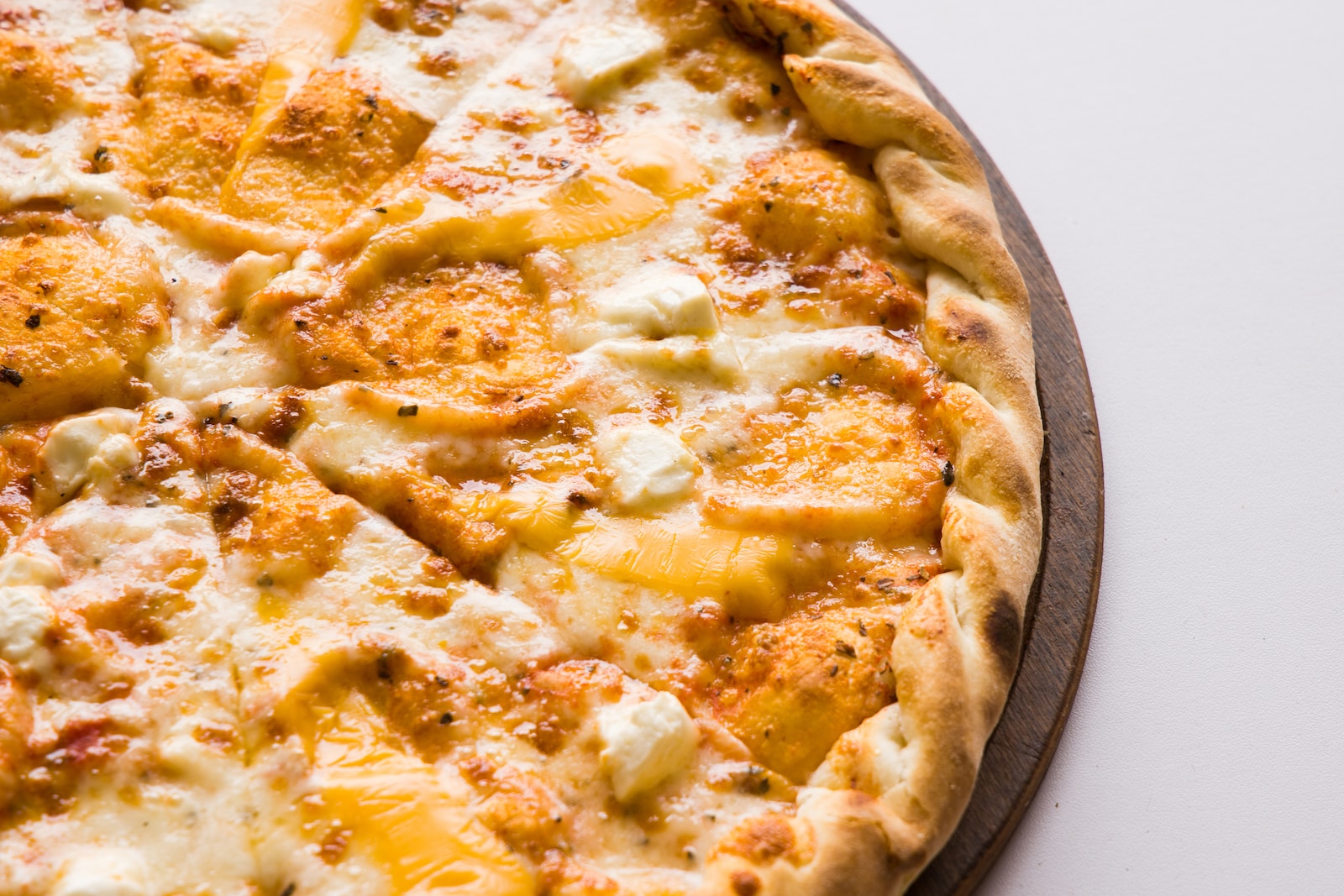 pizza on brown wooden tray