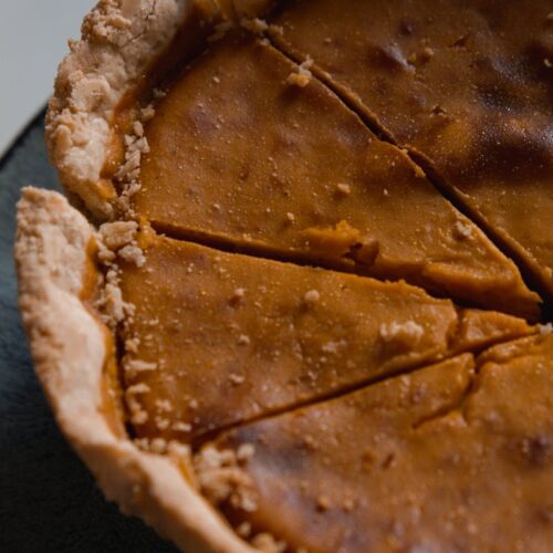 Close Up Photo of Sliced Pumpkin Pie