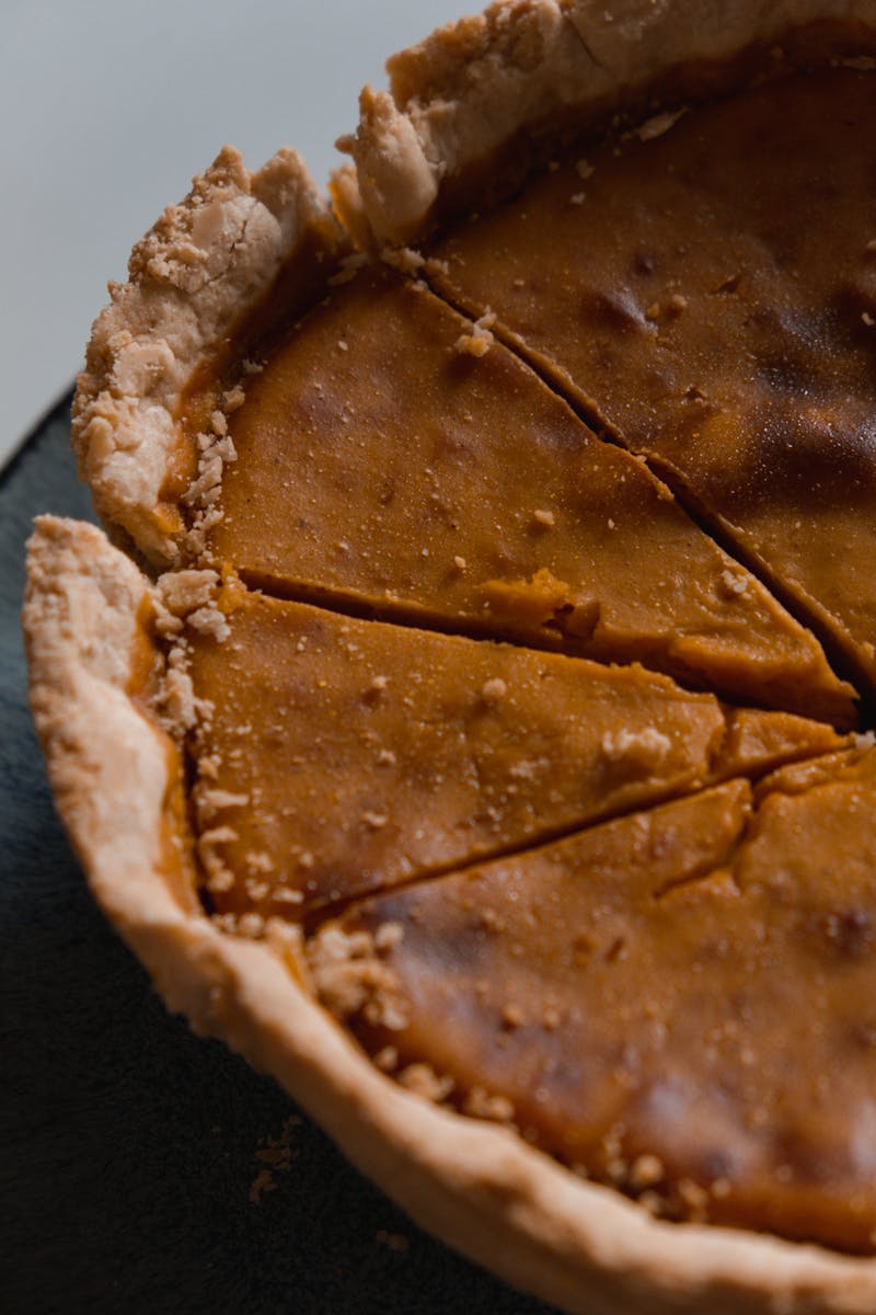 Close Up Photo of Sliced Pumpkin Pie