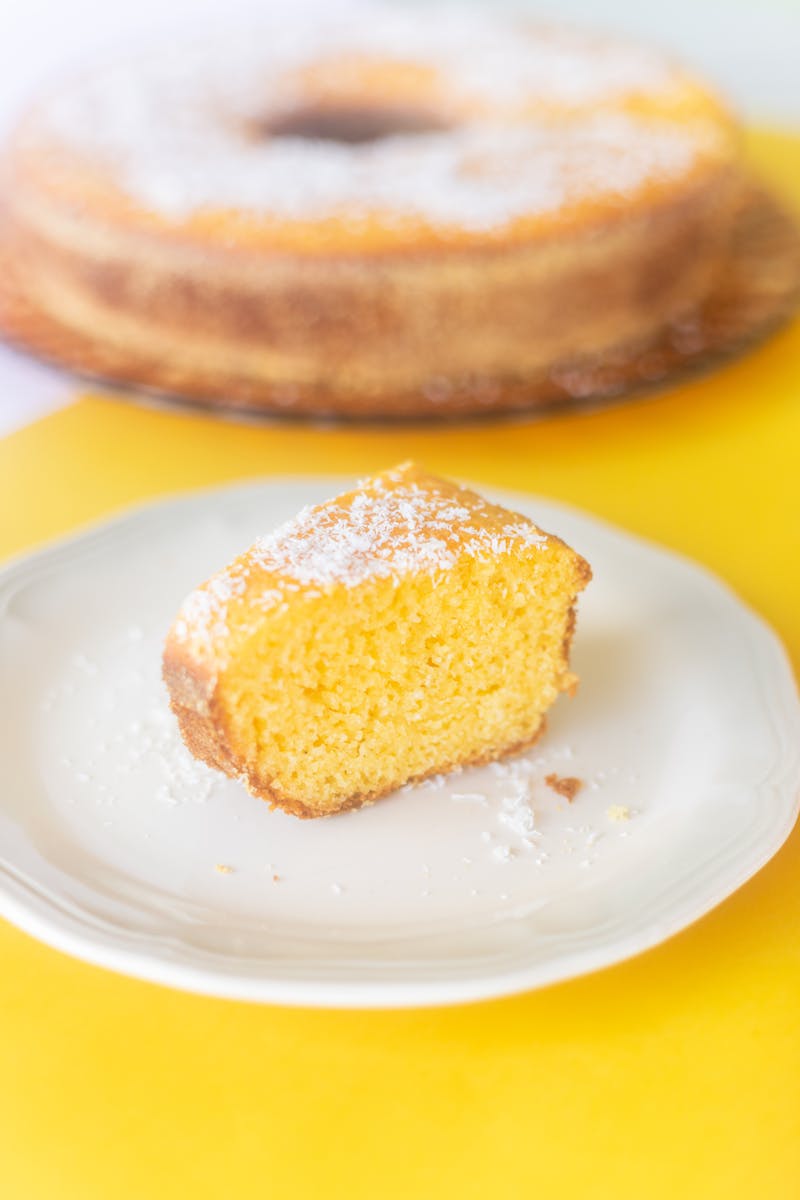 Tasty slice of cake on table