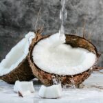 white round cake with white cream on brown wooden round tray