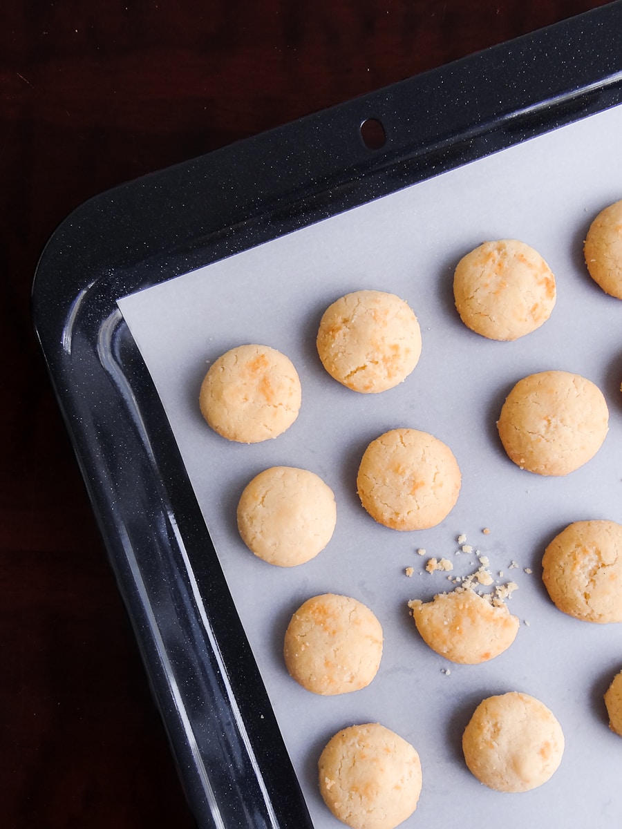 A pan filled with cookies on top of a wooden table