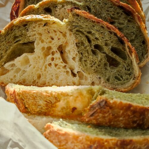 A loaf of bread sitting on top of a piece of wax paper