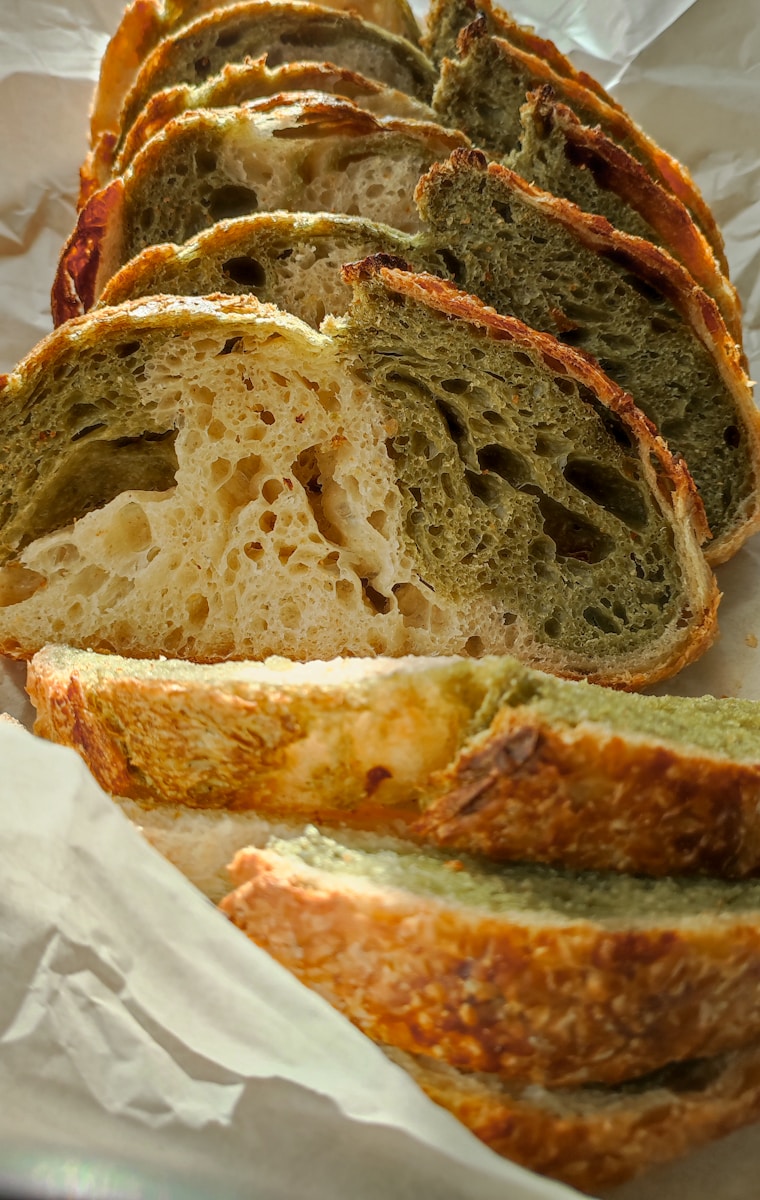 A loaf of bread sitting on top of a piece of wax paper