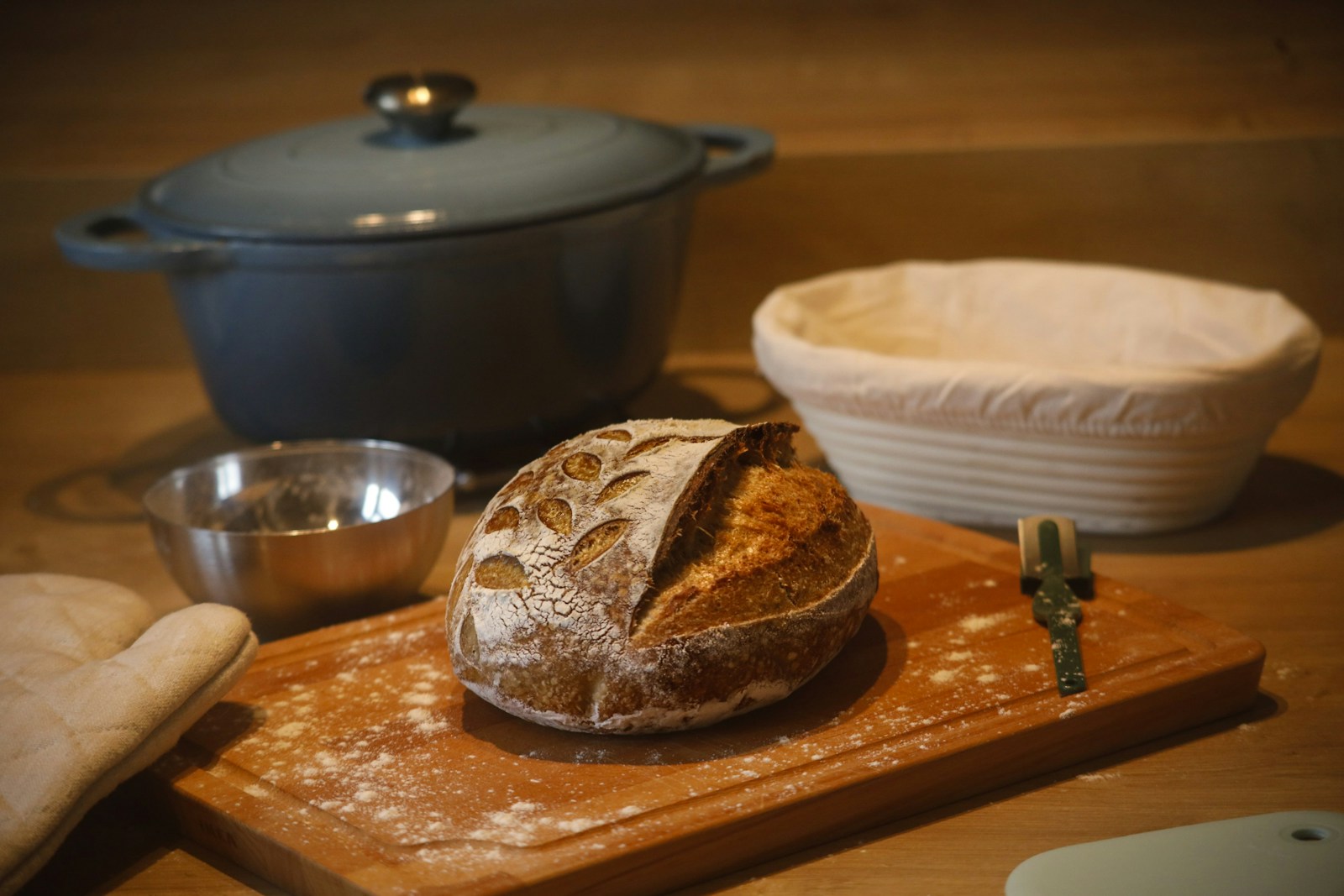 A loaf of bread sitting on top of a wooden cutting board